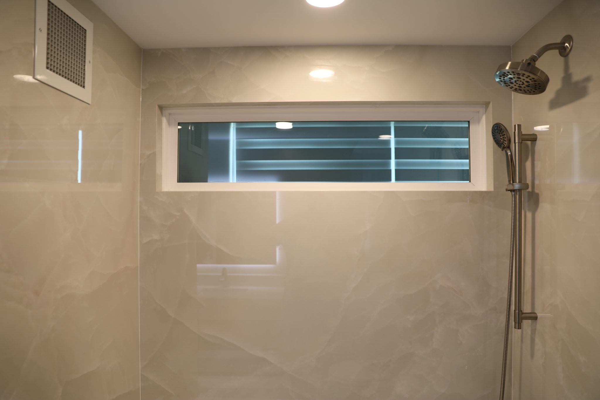 Guest shower tile and rain head