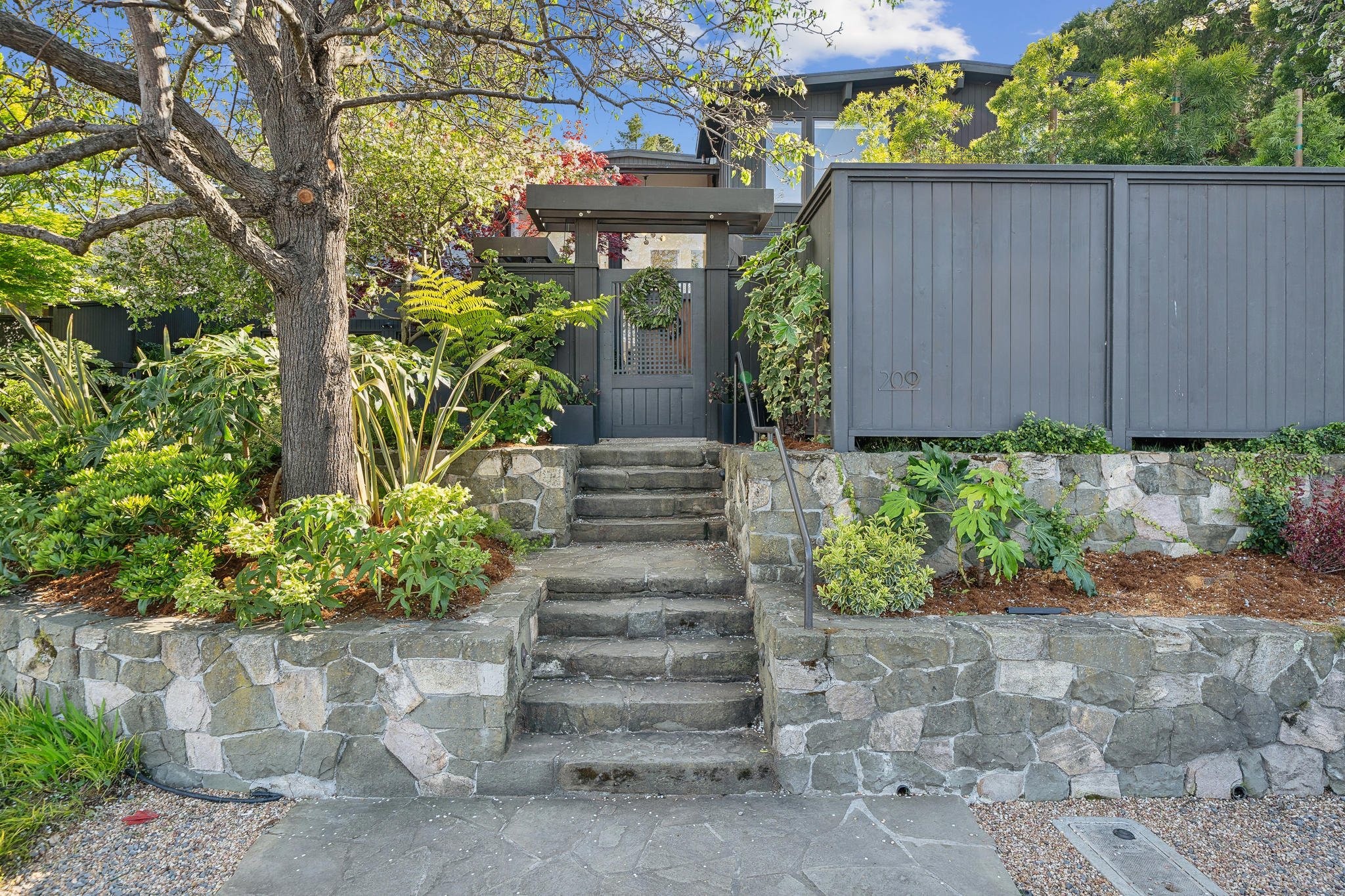Stone steps and gate at the street