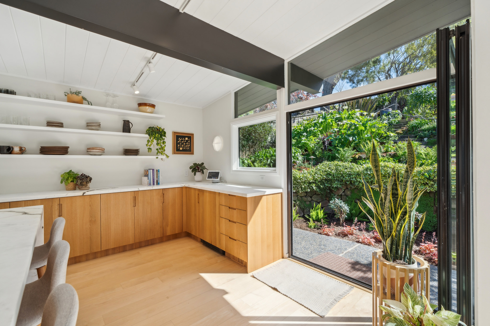 Oak pantry and open shelves at the garden glass