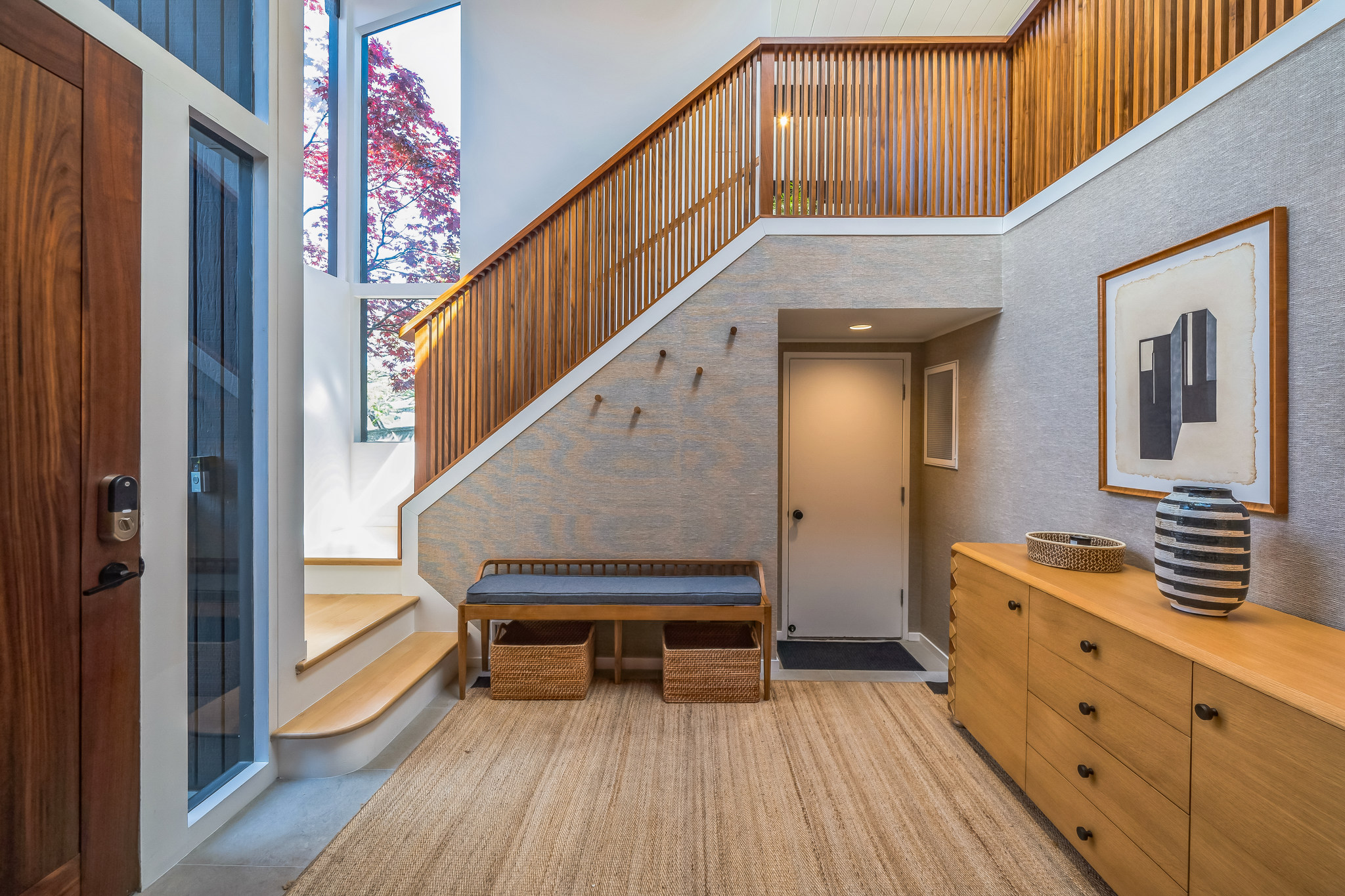Stair landing with wood slat rail and bench