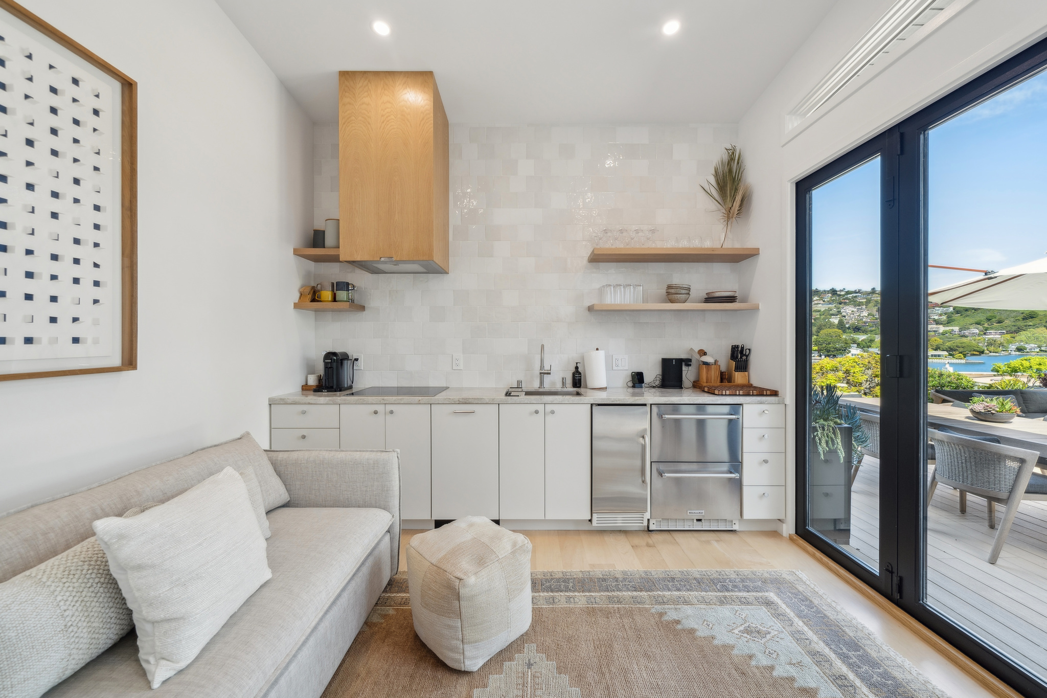 ADU kitchenette opening to the deck and view